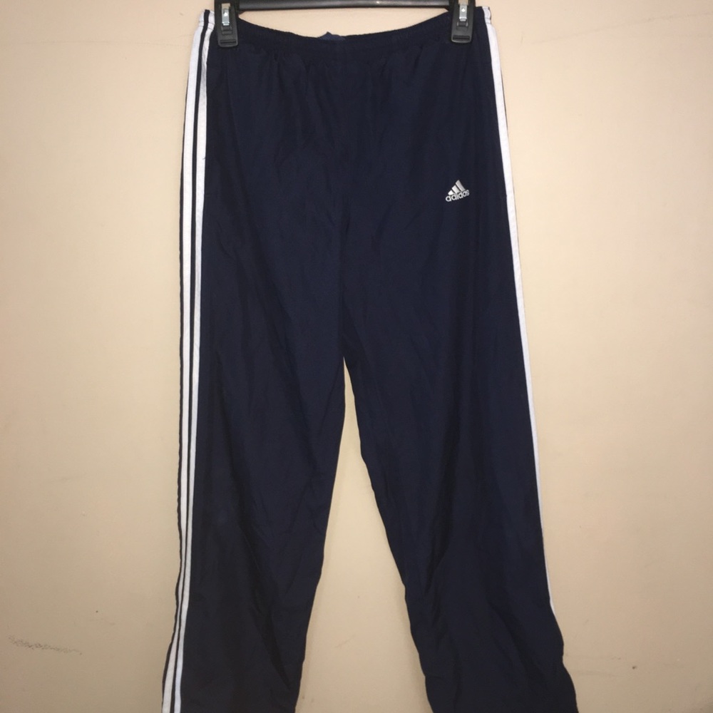 Navy blue adidas pants, vintage style.
